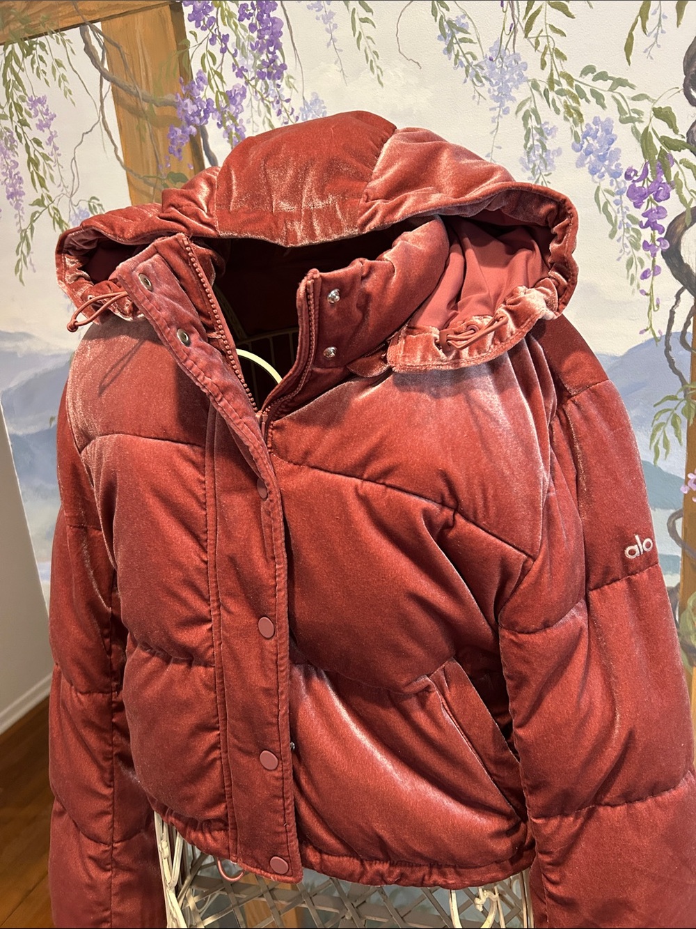 Alo Velvet Puffer Jacket in Mauve pink.